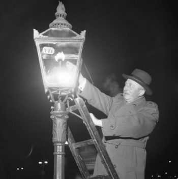 Lighting a gas streetlight in Stockholm, 1953.